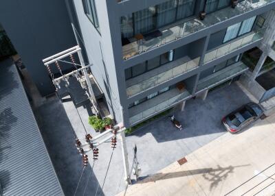 Aerial view of building with parking area