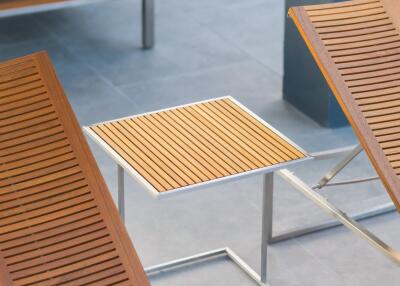 Modern outdoor seating area with wooden furniture