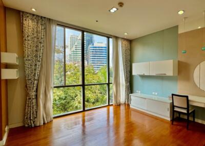 Bright living room with large windows and city view