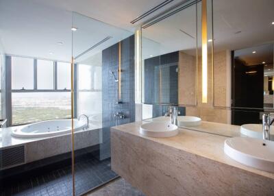 Modern bathroom with double sinks and a bathtub