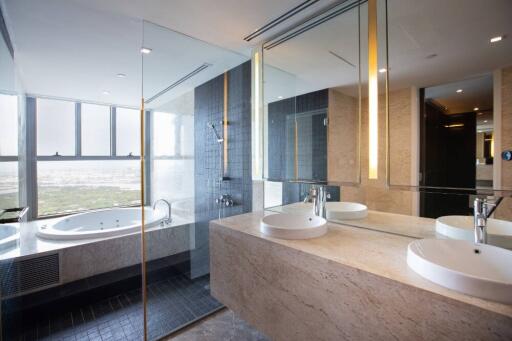 Modern bathroom with double sinks and a bathtub