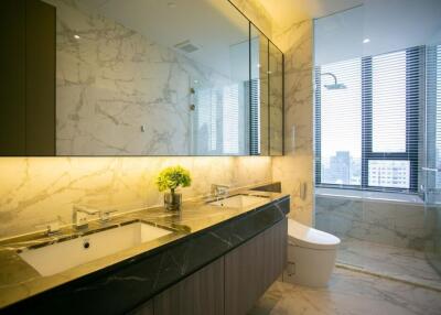 Modern bathroom with marble finishes and dual sinks