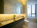 Modern bathroom with marble finishes and dual sinks