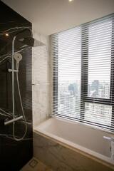 Modern bathroom with shower and large window