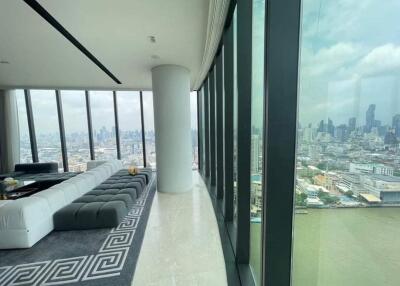 Modern living room with floor-to-ceiling windows and city view