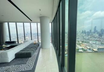 Modern living room with floor-to-ceiling windows and city view