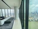 Modern living room with floor-to-ceiling windows and city view