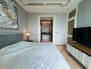 Modern bedroom with view into a bathroom