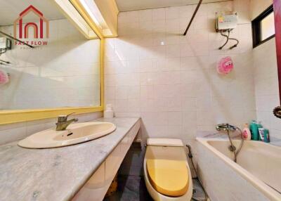 Bathroom with sink, mirror, toilet, and bathtub