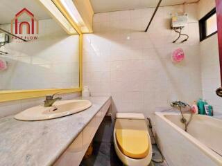 Bathroom with sink, mirror, toilet, and bathtub