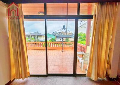 Living room with a view of the balcony and outdoor space