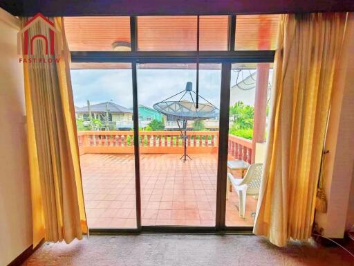 Living room with a view of the balcony and outdoor space