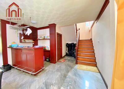 Bright kitchen with stairway