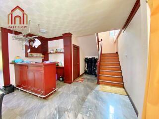 Bright kitchen with stairway