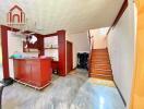 Bright kitchen with stairway