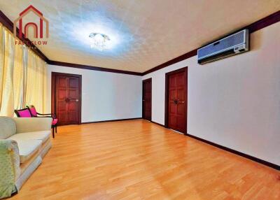 Spacious living room with wooden flooring and modern furnishings