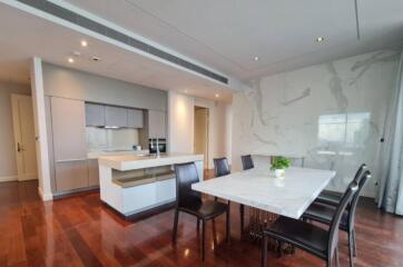 Modern dining area with kitchen view