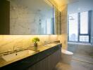 Luxurious modern bathroom with dual sinks and large mirror