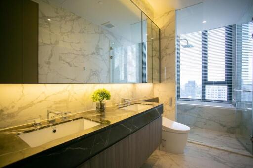 Luxurious modern bathroom with dual sinks and large mirror