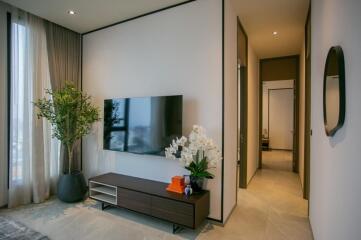 Modern living room with TV and plants