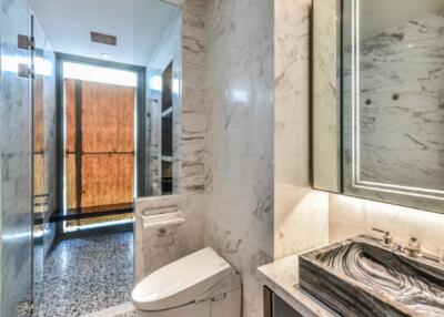 Modern bathroom with marble walls and stylish fixtures