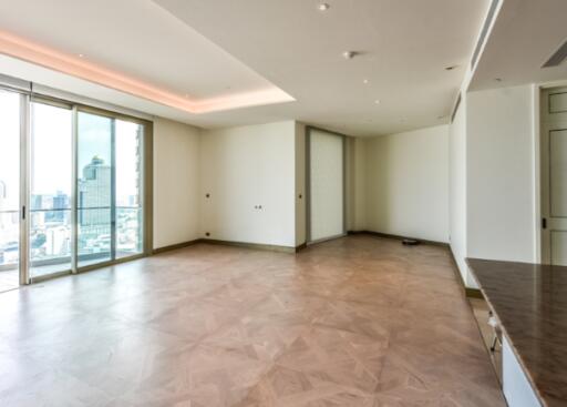 Spacious living room with a city view and large windows