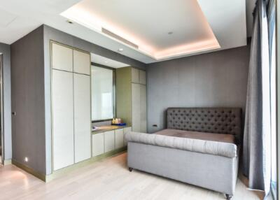 Modern bedroom with gray upholstered bed