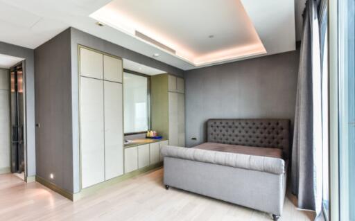 Modern bedroom with gray upholstered bed