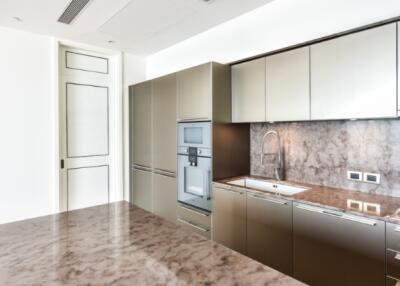 Modern kitchen with sleek cabinetry and marble countertop