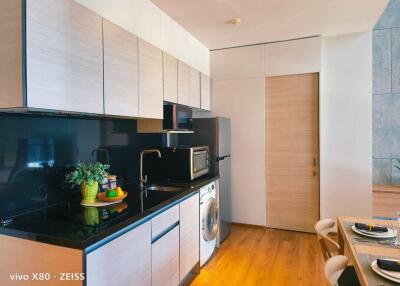 Modern kitchen with appliances and dining area