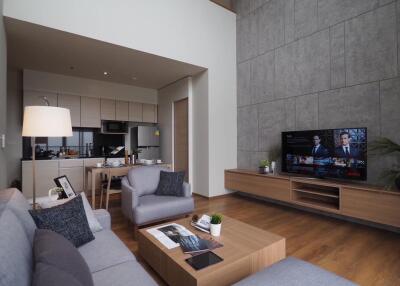 Modern living room with kitchen view and television