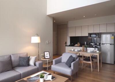 Modern living room with open kitchen and loft