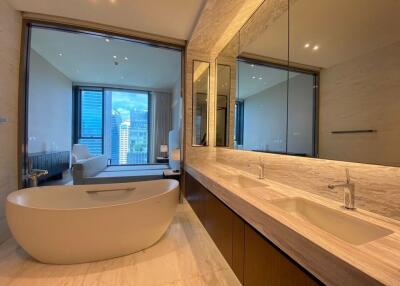 Modern bathroom with bathtub and large mirrors