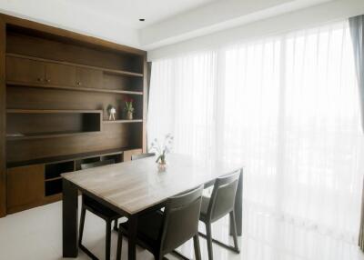 Bright Dining Room with Wooden Shelving