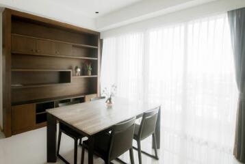 Bright Dining Room with Wooden Shelving