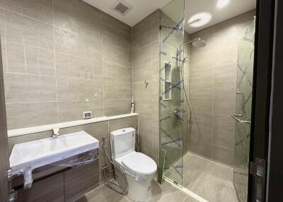 Modern bathroom with a walk-in shower and white fixtures