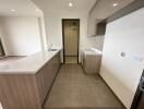 Modern kitchen with marble countertop and ceramic flooring