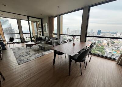 Living room with large windows and a city view