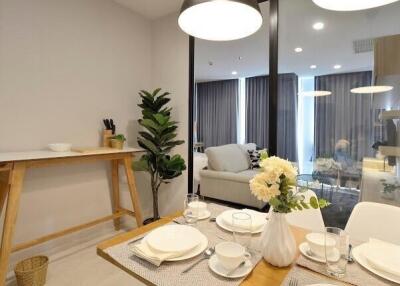 Modern dining area adjacent to living room