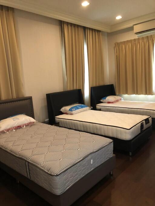 Bedroom with three single beds