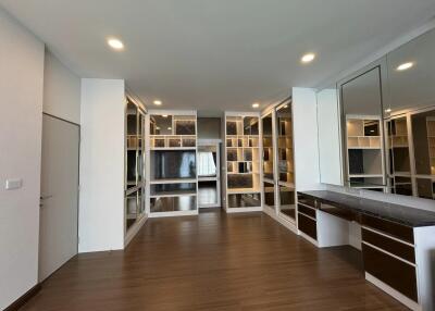 Modern living space with built-in shelves and large mirror