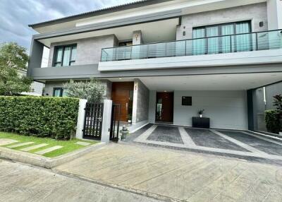 Modern two-story house with balcony and garage