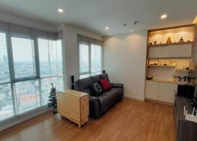 Modern living room with large windows and wooden floor