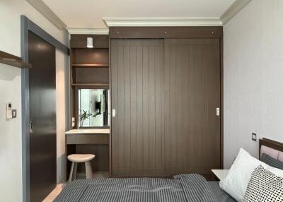 Modern bedroom with built-in wardrobe and small dressing table