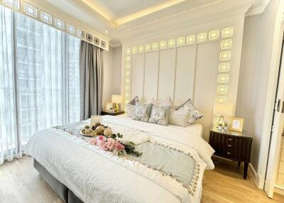 Beautifully decorated bedroom with king-size bed, natural light and modern furnishings