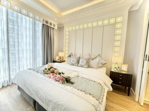 Beautifully decorated bedroom with king-size bed, natural light and modern furnishings