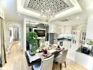 Elegant dining and kitchen area with chandelier and modern decor