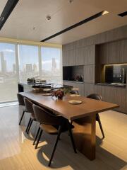 Modern kitchen with dining area and city view