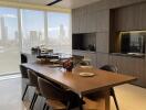 Modern kitchen with dining area and city view