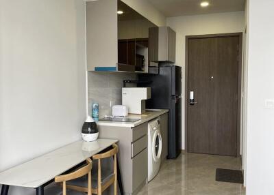 Modern small kitchen area with dining space